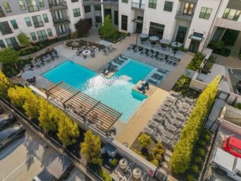 Resort-style saltwater swimming pool with tanning ledges and sundeck